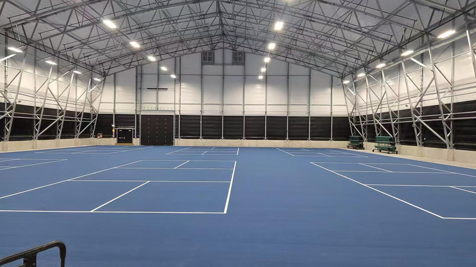 Indoor courts with textured acrylic sports surfacing and line striping